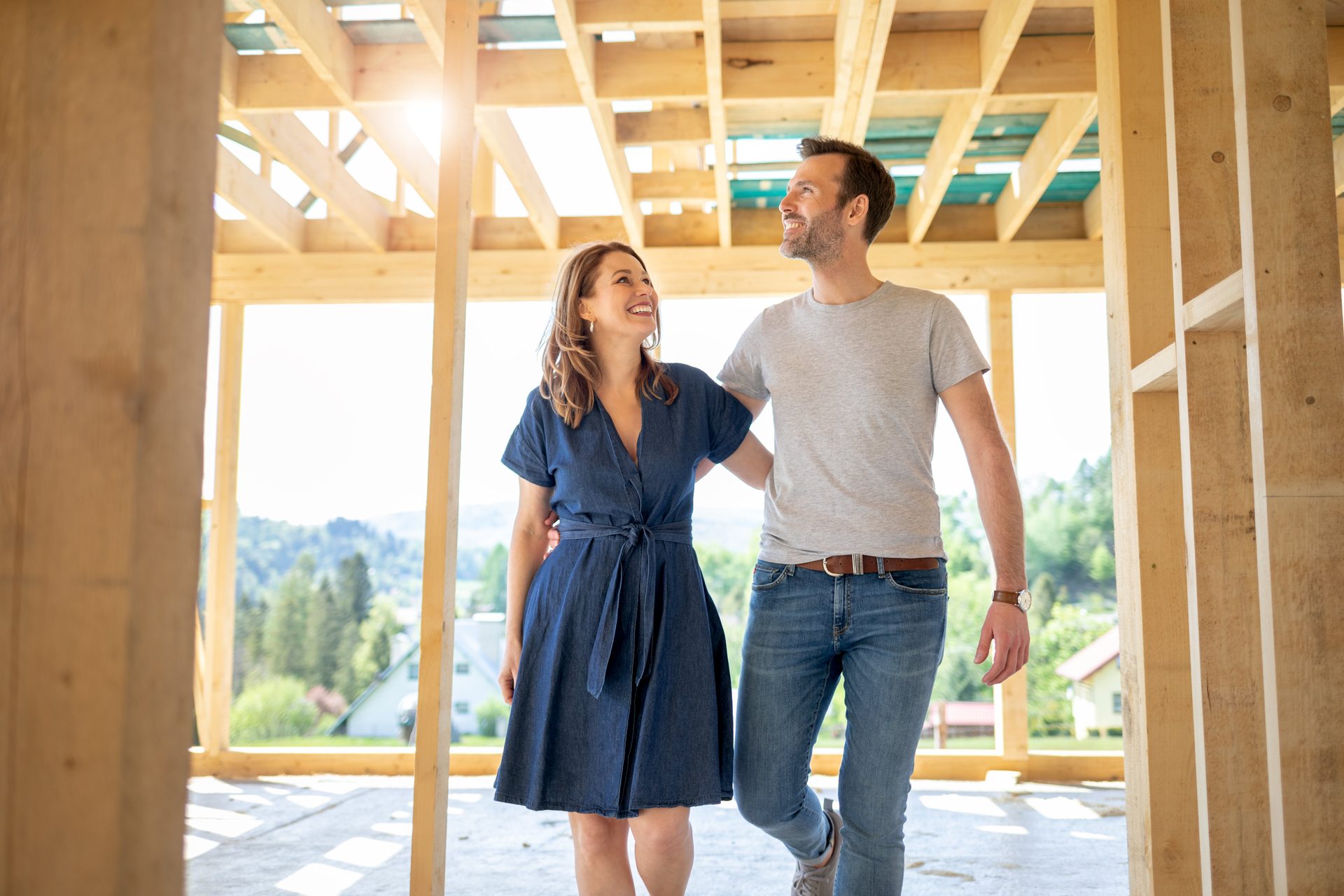 Happy couple visiting the construction site of their new home